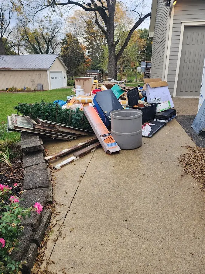 Dumpster being loaded with debris for Estate Cleanout Dumpster Rental in Kinderhook